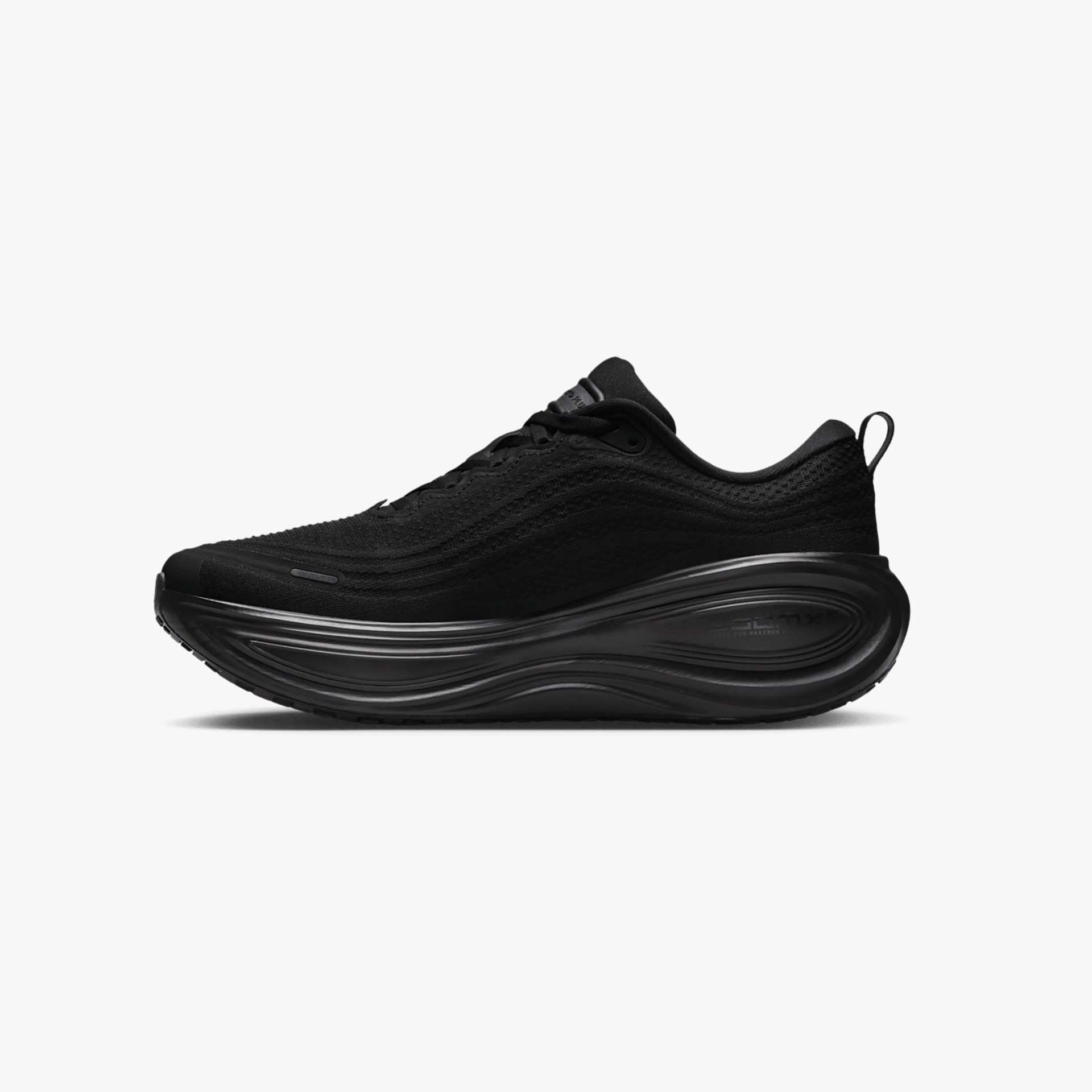 Black athletic sneaker with thick, sculpted sole and mesh upper, side view on white background.
