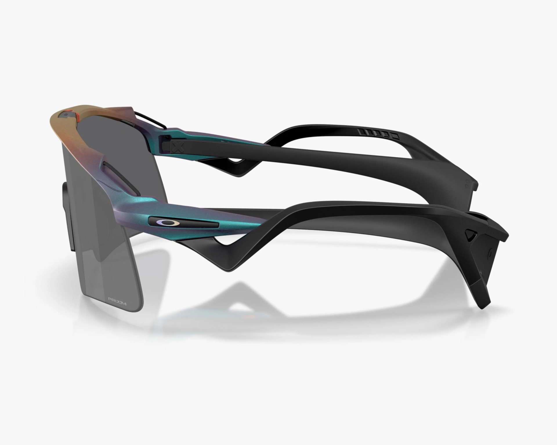 Sporty wraparound sunglasses with black and iridescent blue-green frame and dark rectangular lenses.