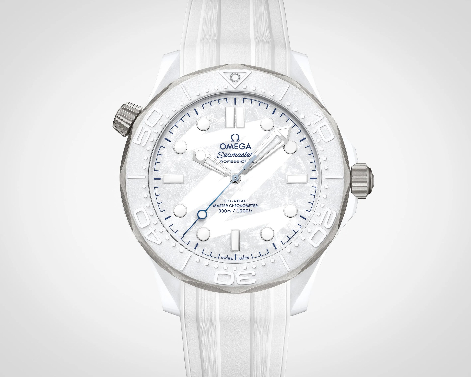 White Omega Seamaster Professional watch with textured dial, white bezel, and white rubber strap.