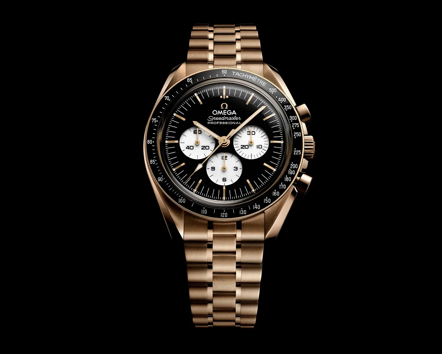 Gold Omega Speedmaster Professional chronograph watch with black dial and white subdials on a matching gold bracelet.