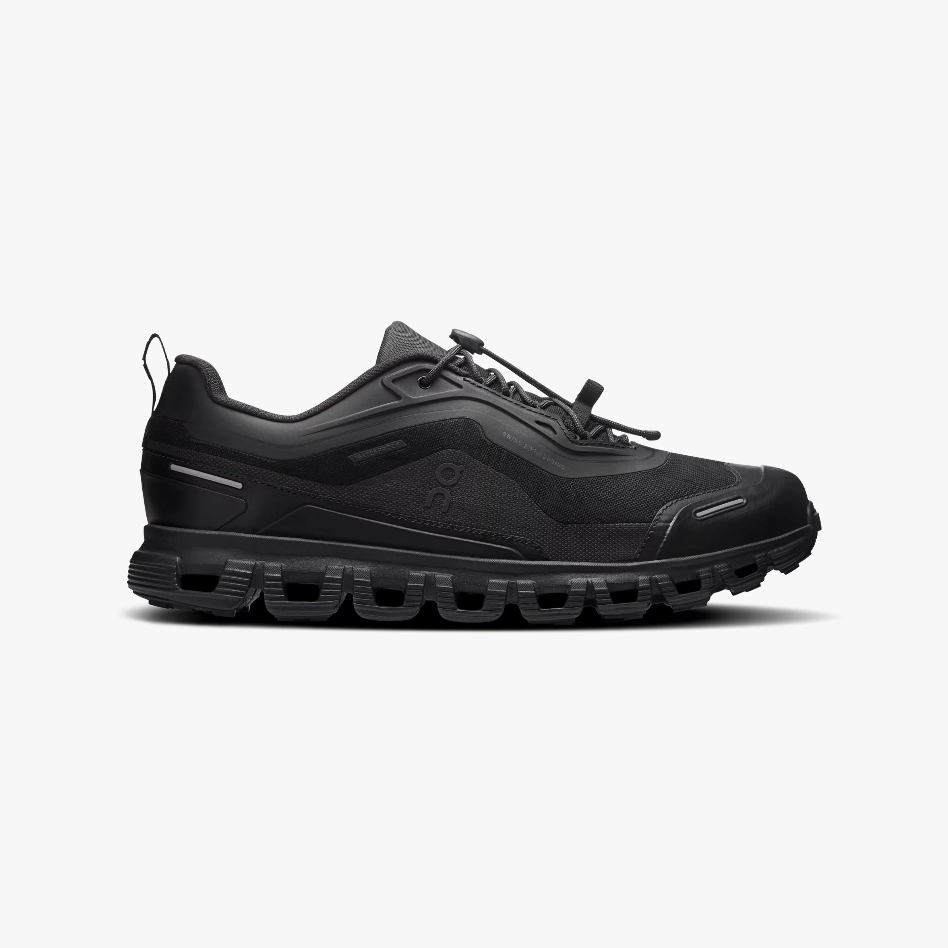 Black waterproof athletic shoe with textured sole and quick-lace system on a white background.