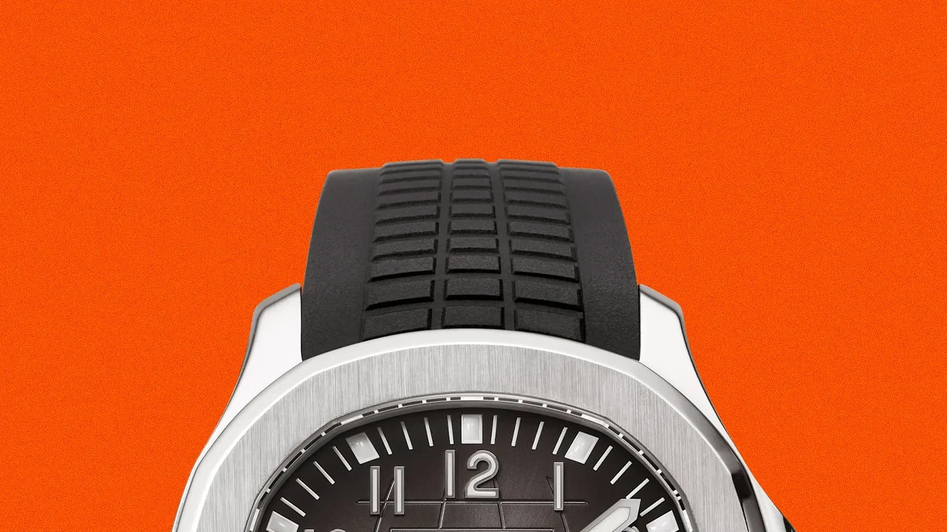 Black rubber strap watch with a brushed silver octagonal bezel and black dial.
