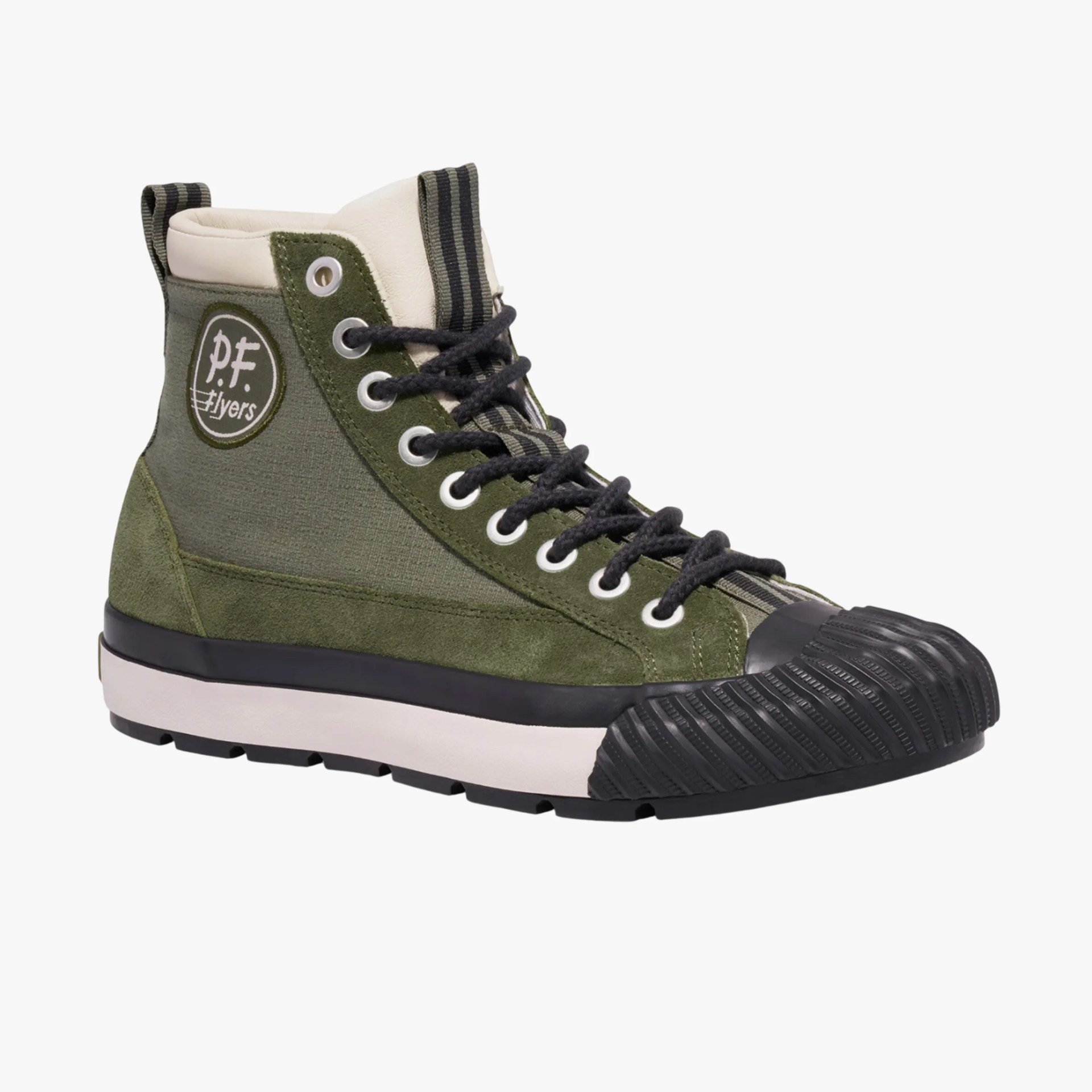 High-top sneaker in olive green canvas and suede with black rubber toe cap and white sole, featuring "p.f. flyers" logo patch.