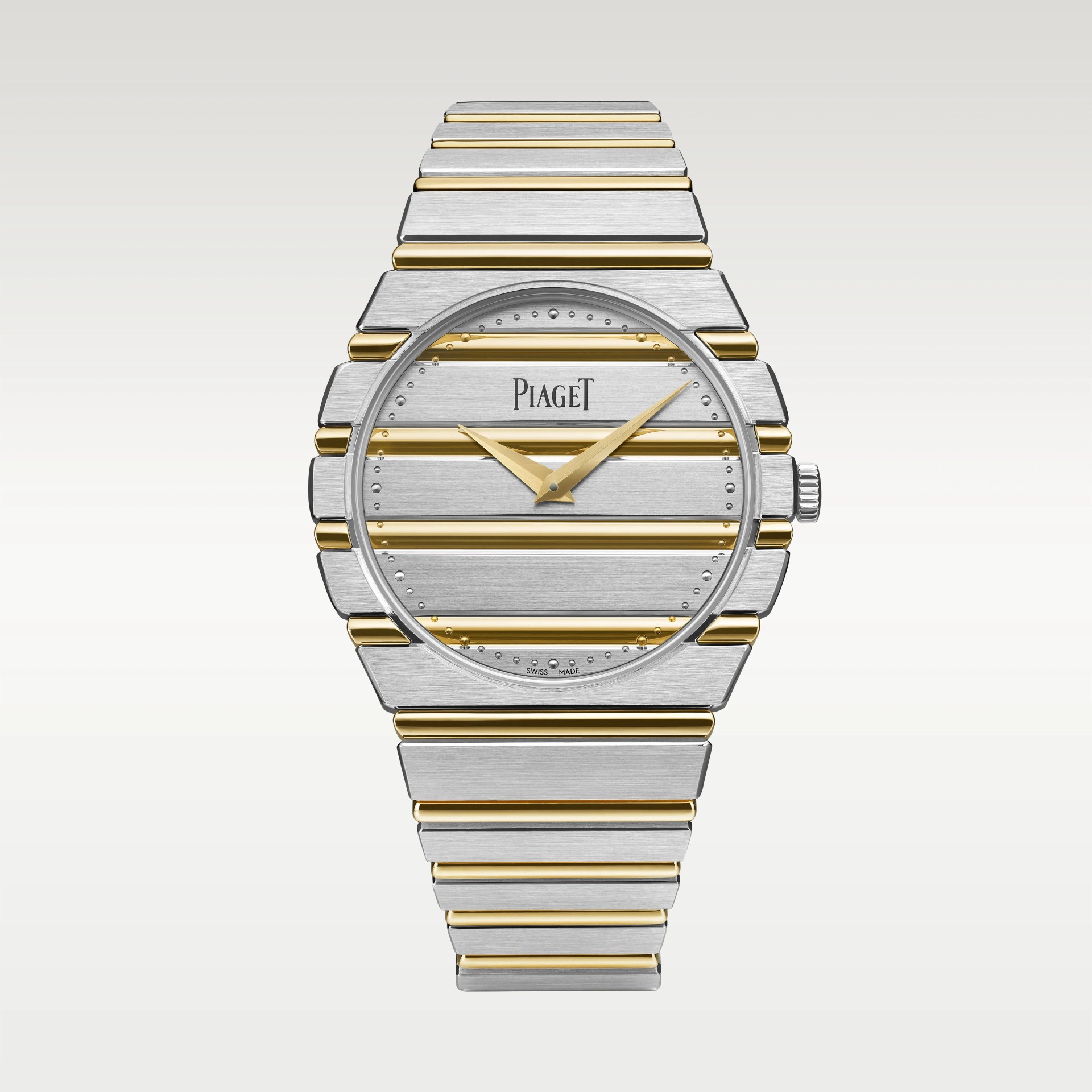 Silver and gold striped Piaget wristwatch with gold hands and integrated metal bracelet.