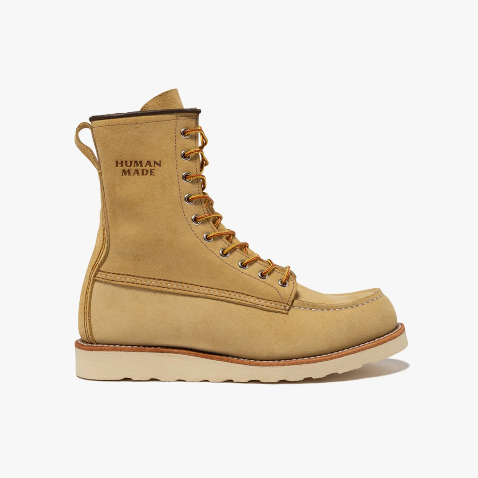 Tan suede lace-up boot with "HUMAN MADE" printed on the side and a light rubber sole.