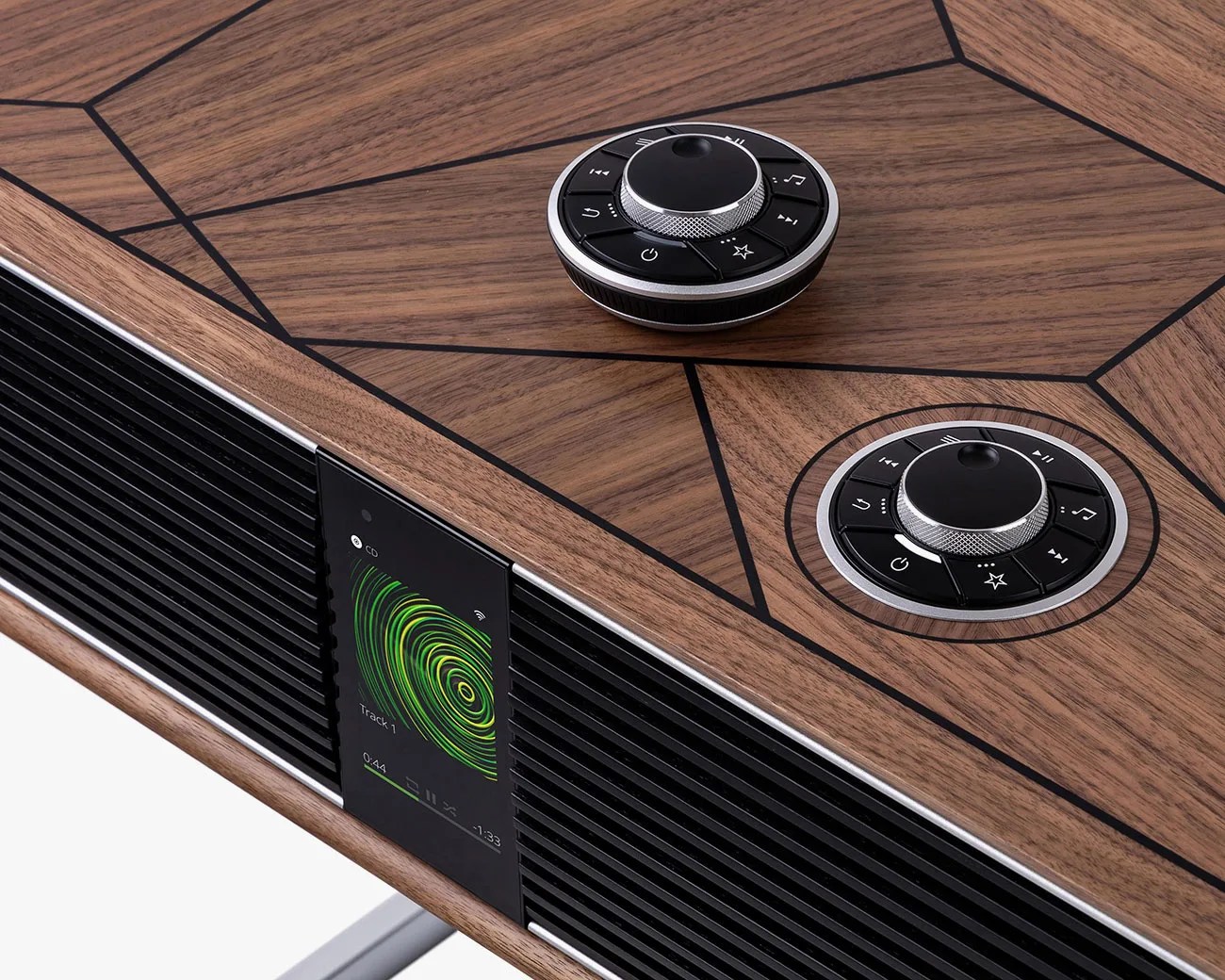 Wood-finished audio system with black control knobs and a digital display showing a green circular pattern.