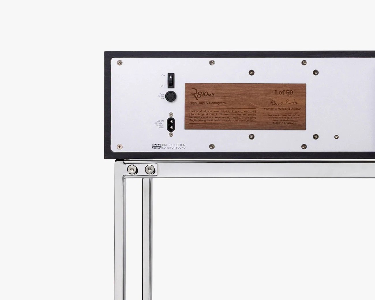 Back panel of a high-fidelity radiogram with power switch, fuse, AC input, and wooden plaque on a black frame.