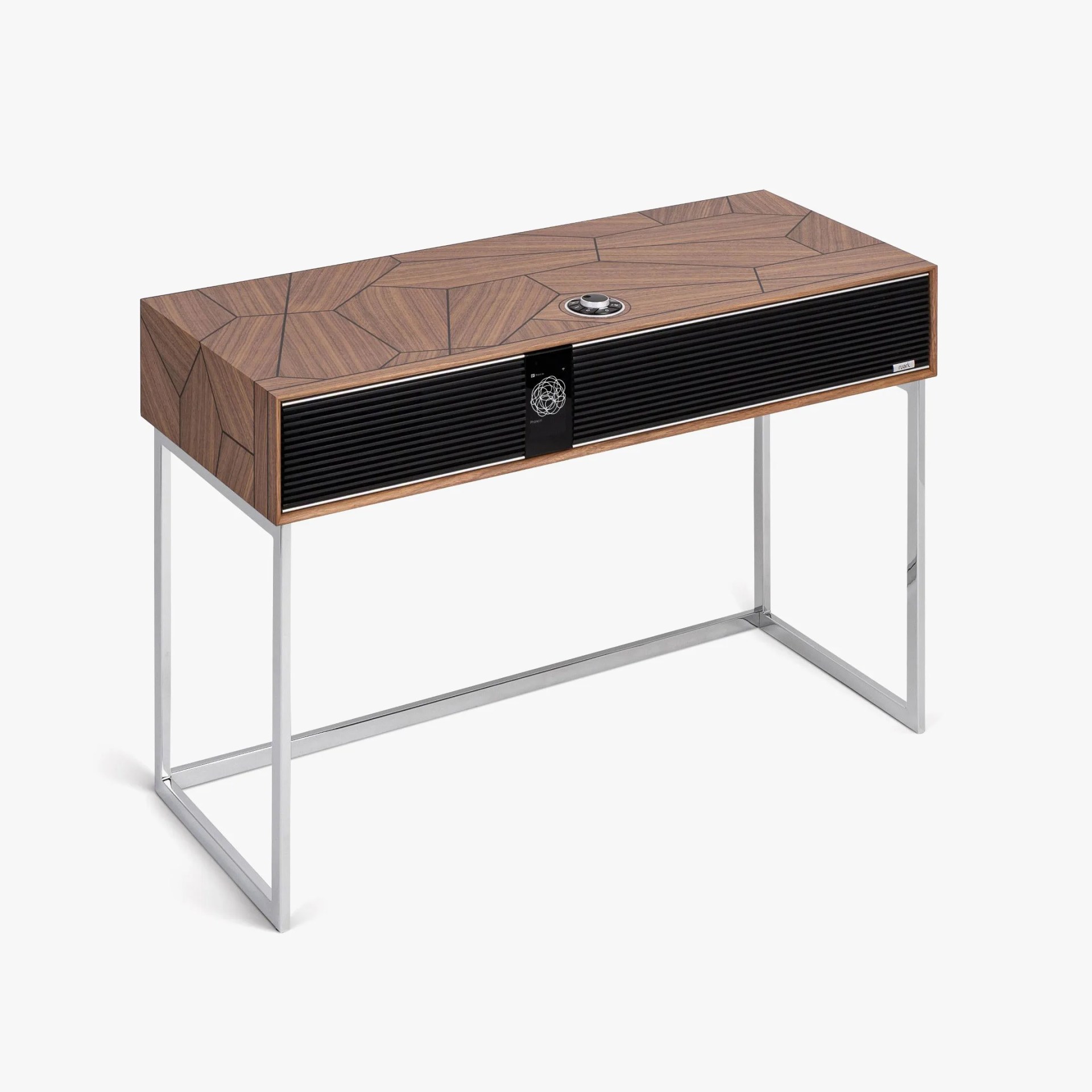 Rectangular wooden speaker with geometric pattern on top, black front grille, and silver metal legs.