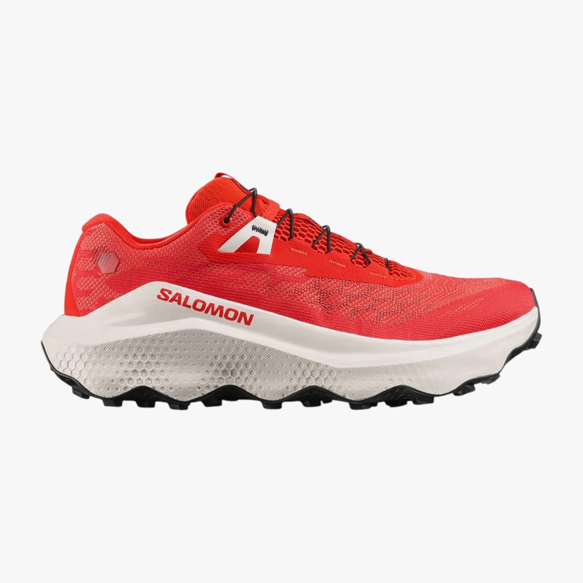 Red Salomon trail running shoe with white midsole and black outsole, side view.