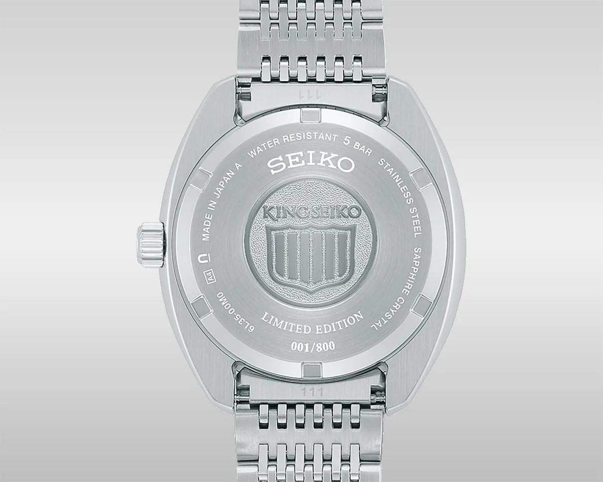 Back of a silver stainless steel King Seiko limited edition watch with engraved logo and water resistance details.