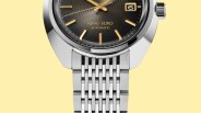 Close-up of a King Seiko automatic watch with a black textured dial, gold markers, and a stainless steel bracelet.