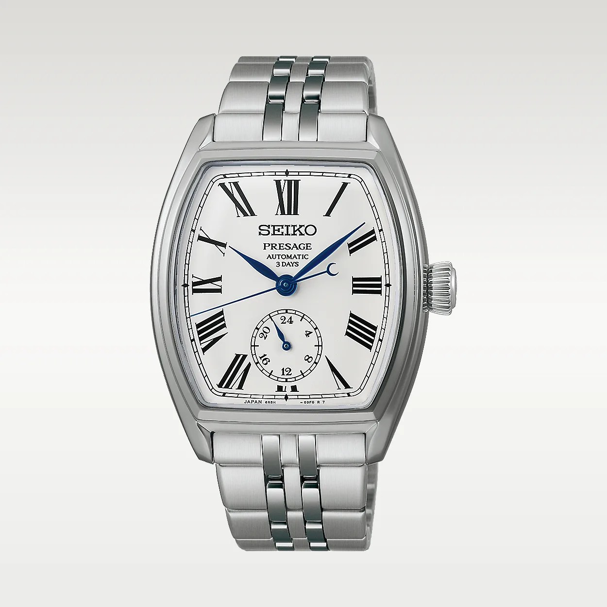 Silver Seiko Presage automatic wristwatch with white dial, blue hands, Roman numerals, and metal bracelet.
