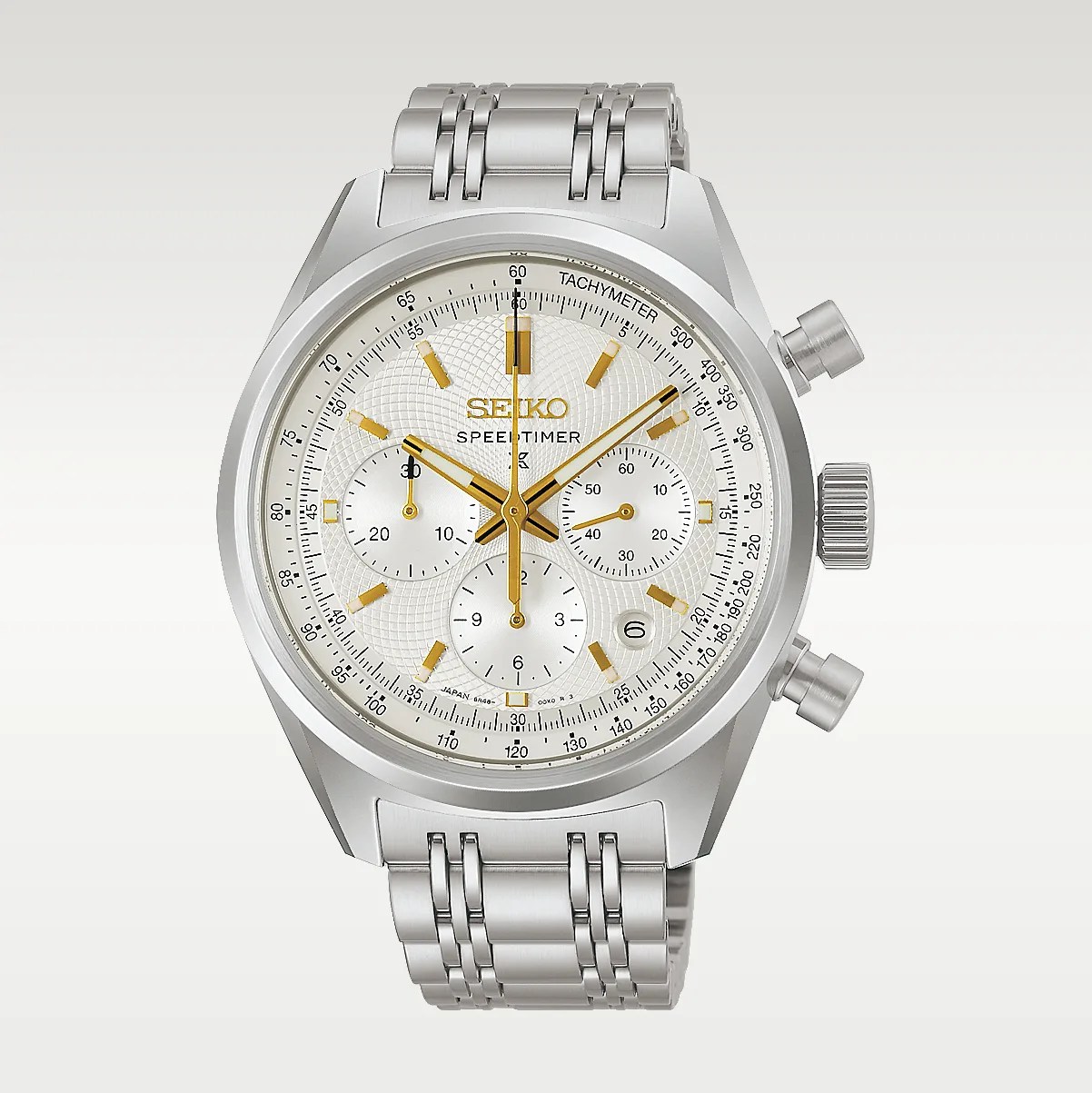 Silver Seiko Speedtimer chronograph watch with gold accents and a stainless steel bracelet.