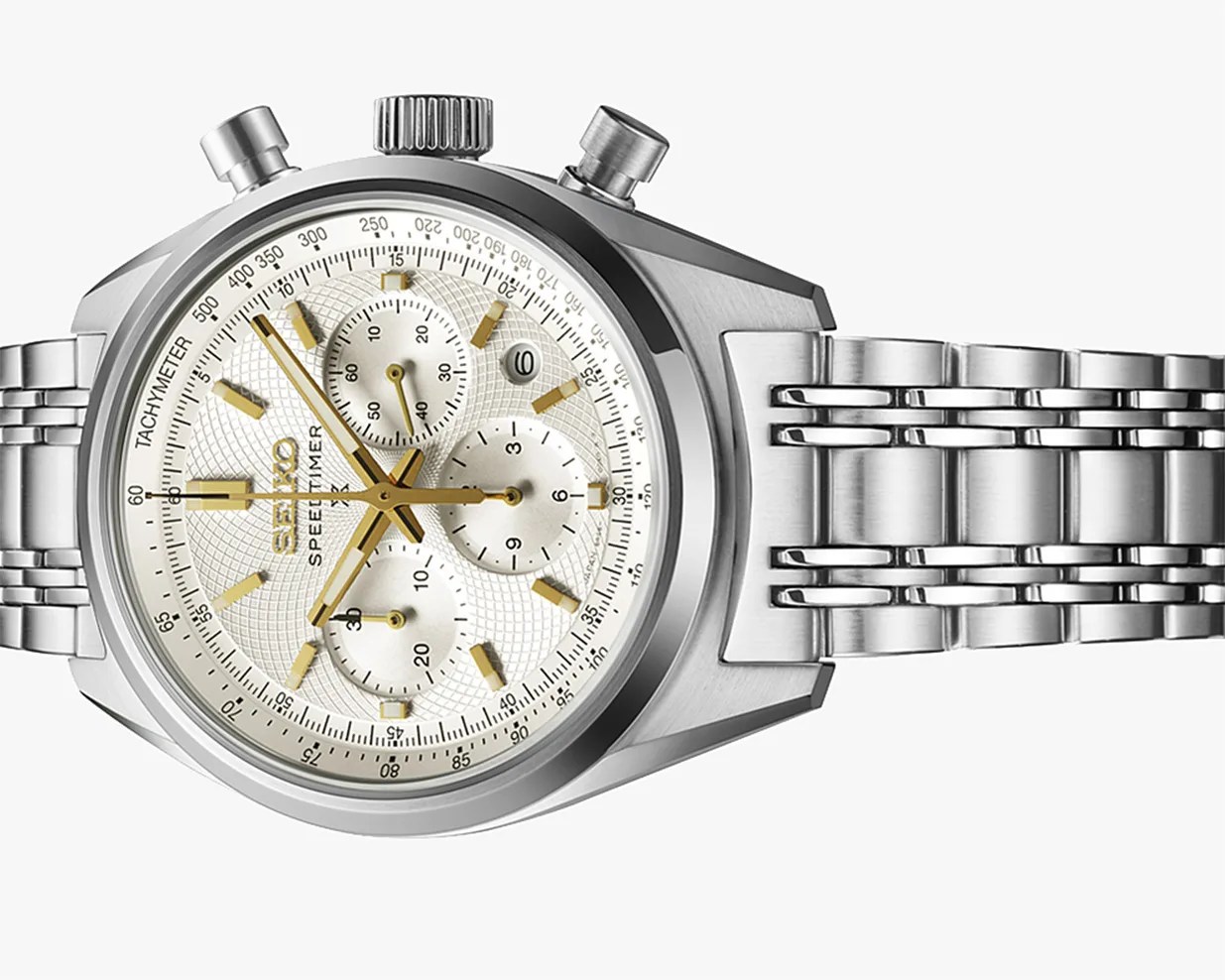 Silver Seiko Speedtimer chronograph watch with gold-tone hands and markers and a stainless steel bracelet.