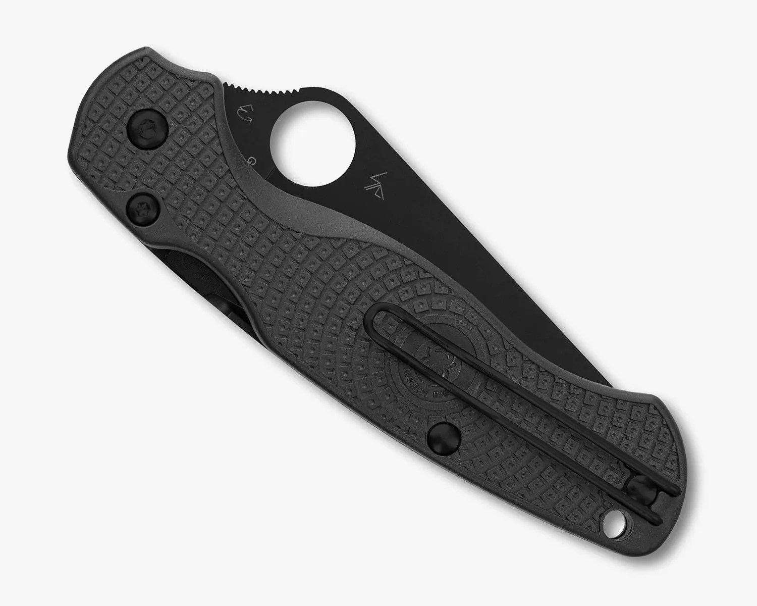 Black folding knife with textured handle and circular thumb hole on blade.