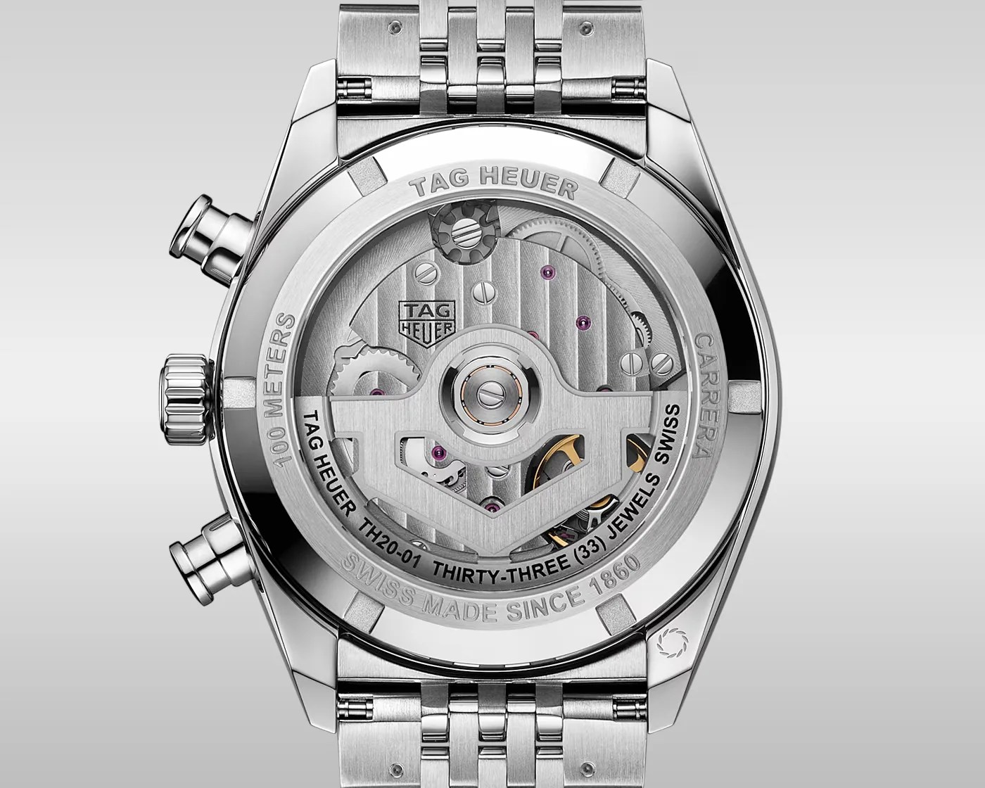 Back view of a TAG Heuer Carrera watch showing the automatic movement with a stainless steel bracelet.