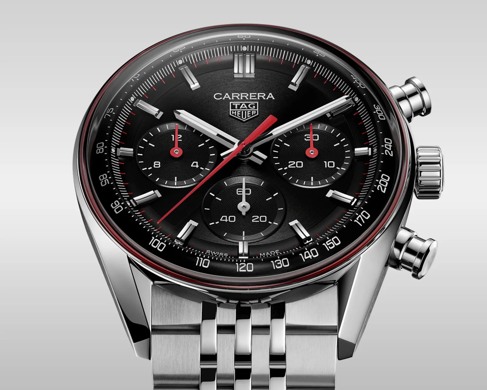 TAG Heuer Carrera chronograph watch with black dial, red and white hands, silver hour markers, and stainless steel bracelet.