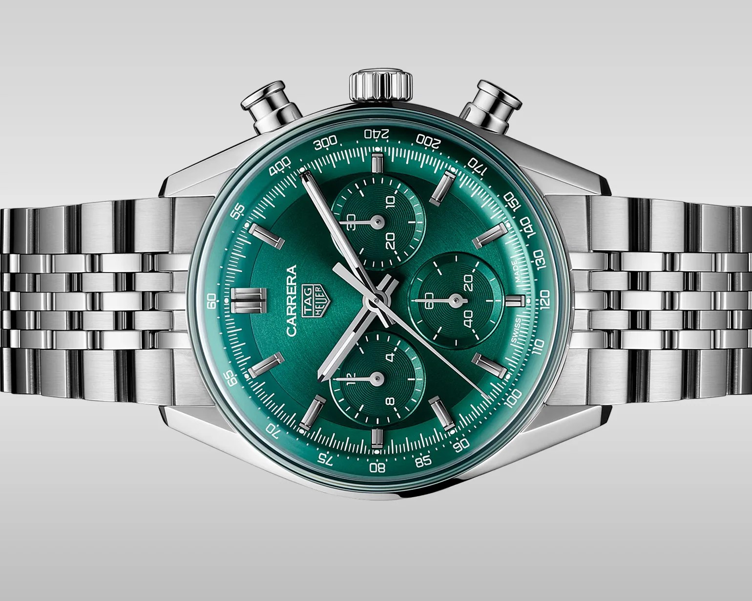 Silver TAG Heuer Carrera chronograph watch with a green dial and stainless steel bracelet.