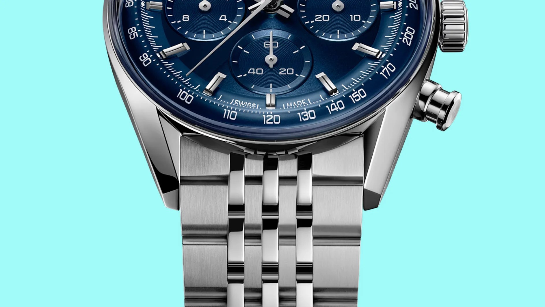 Close-up of a stainless steel watch bracelet attached to a blue chronograph watch face with silver markers and pushers.
