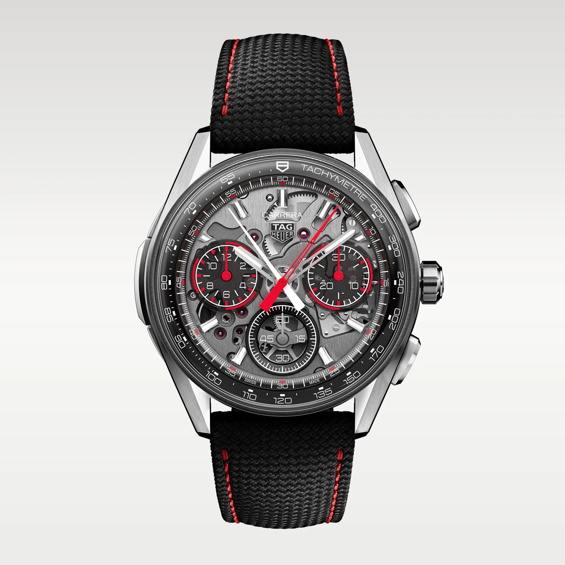 TAG Heuer Carrera chronograph watch with a black textured strap featuring red stitching and a skeleton dial with red and white accents.