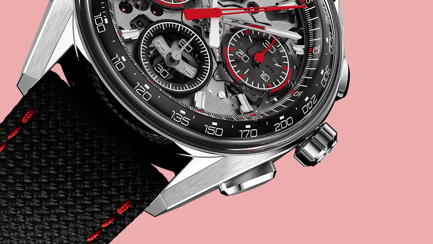 Close-up of a silver chronograph watch with black and red details and a black fabric strap with red stitching on a pink background.