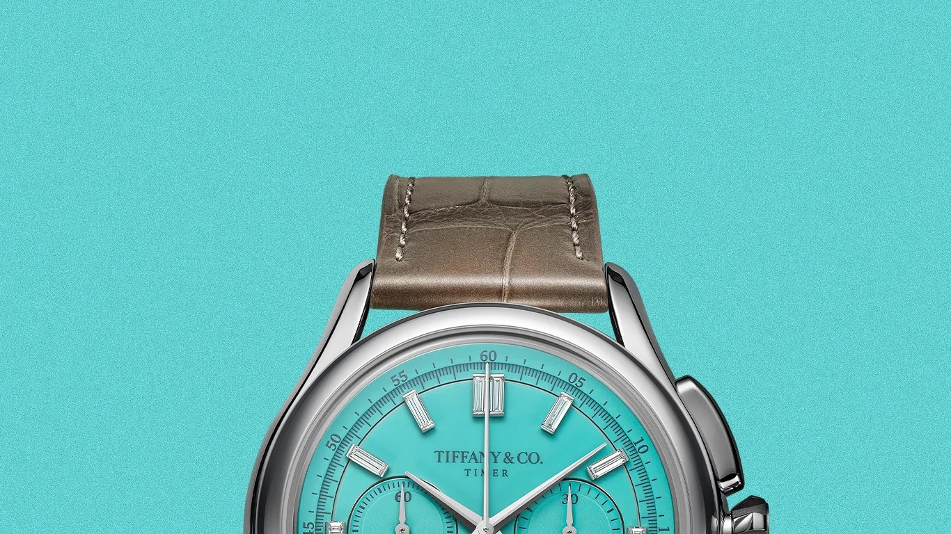 Tiffany & Co. wristwatch with turquoise dial, silver case, and brown leather strap.