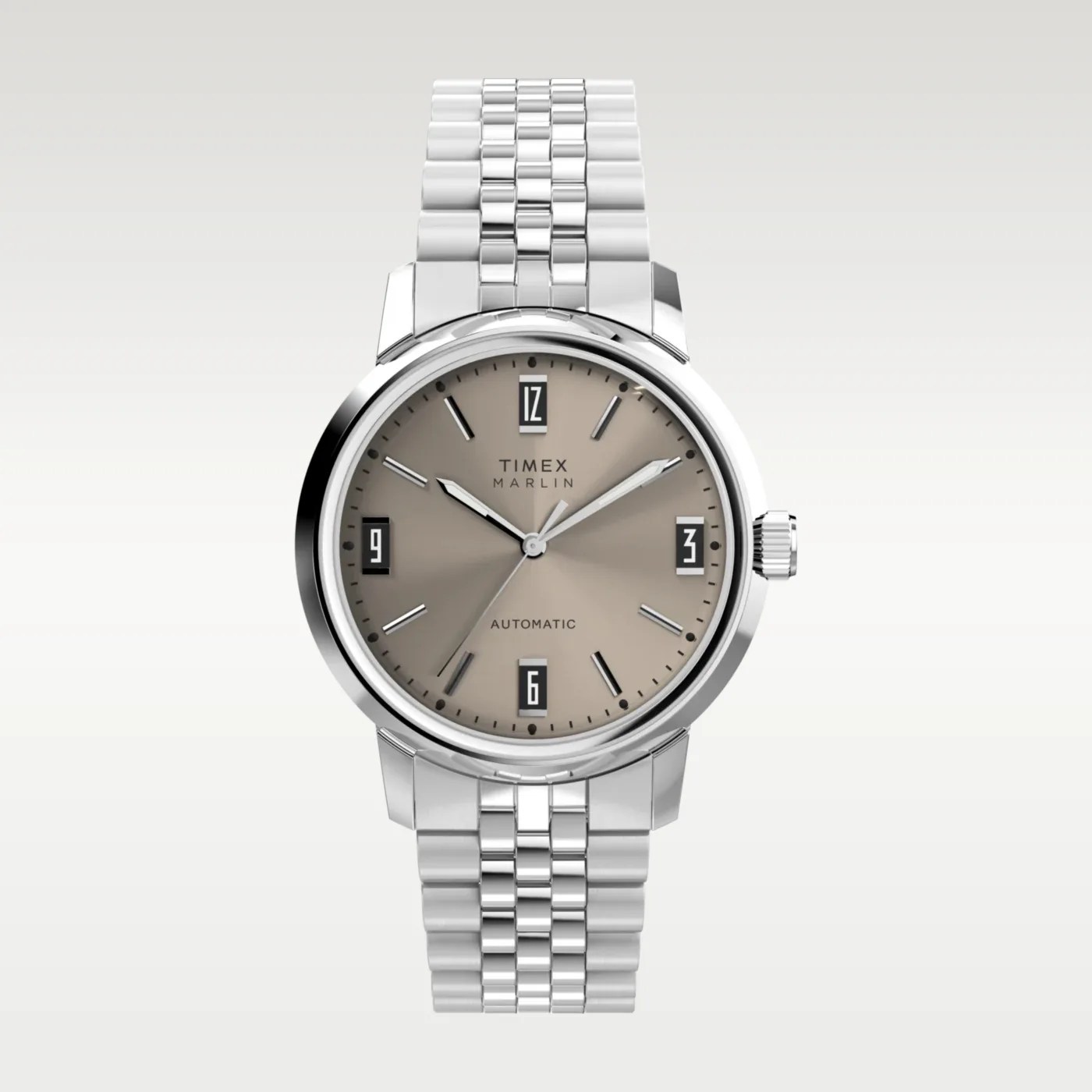 Silver Timex Marlin automatic wristwatch with beige dial and black-bordered date windows at 12, 3, 6, and 9 o'clock.