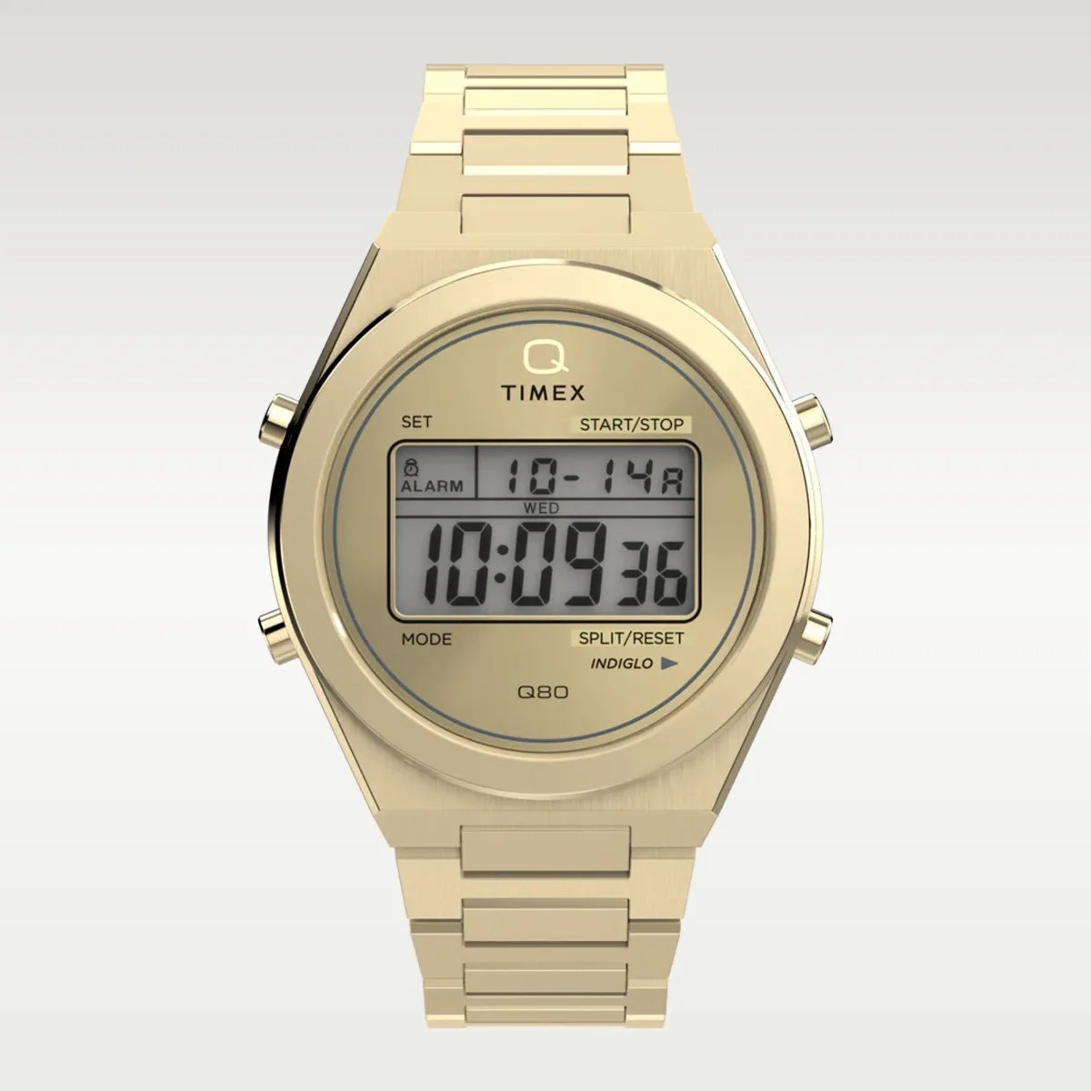 Gold-tone Timex Q digital watch with metal link bracelet and rectangular digital display.