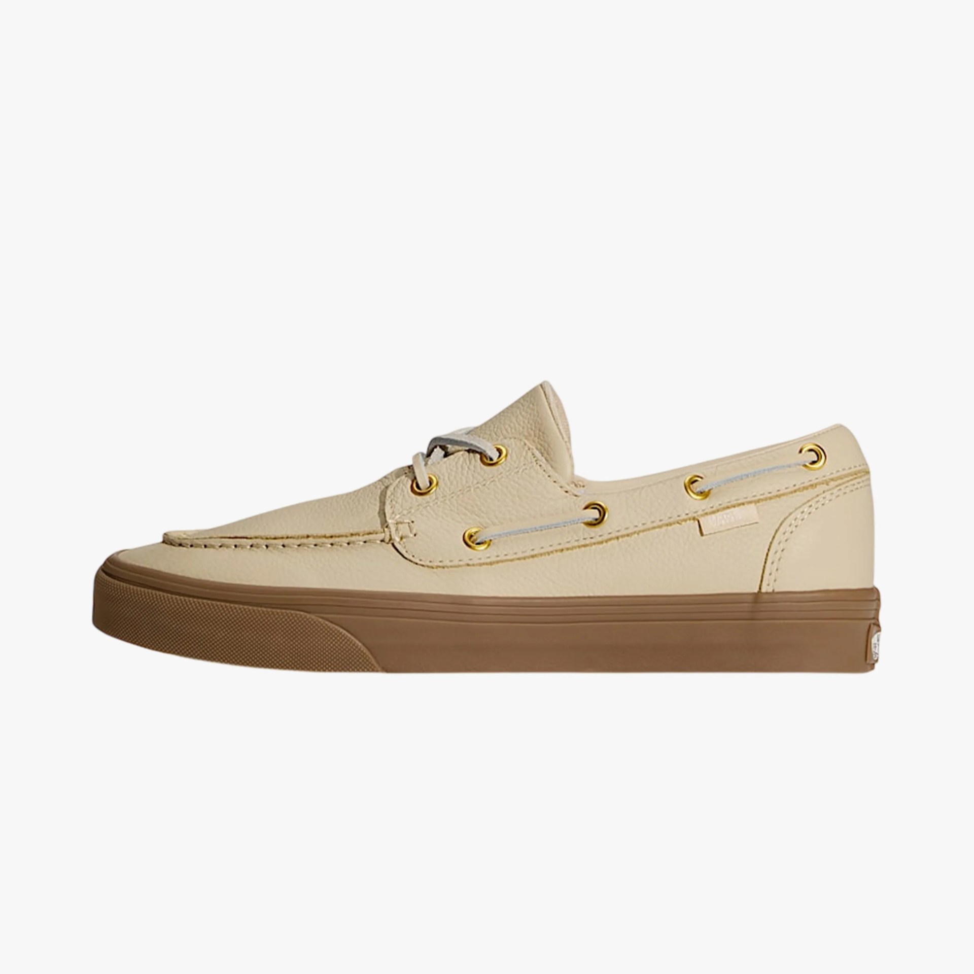 Beige leather boat shoe with gold eyelets and brown rubber sole on a white background.