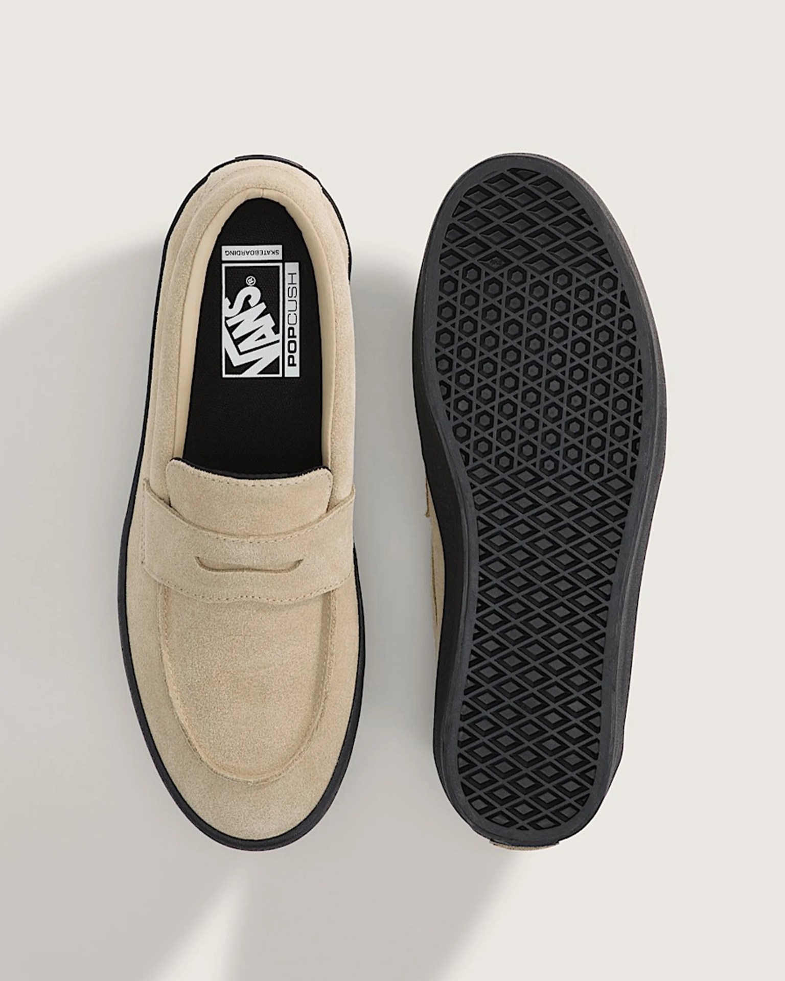 Beige suede Vans slip-on shoes with black rubber soles, one showing top view and the other showing sole pattern.