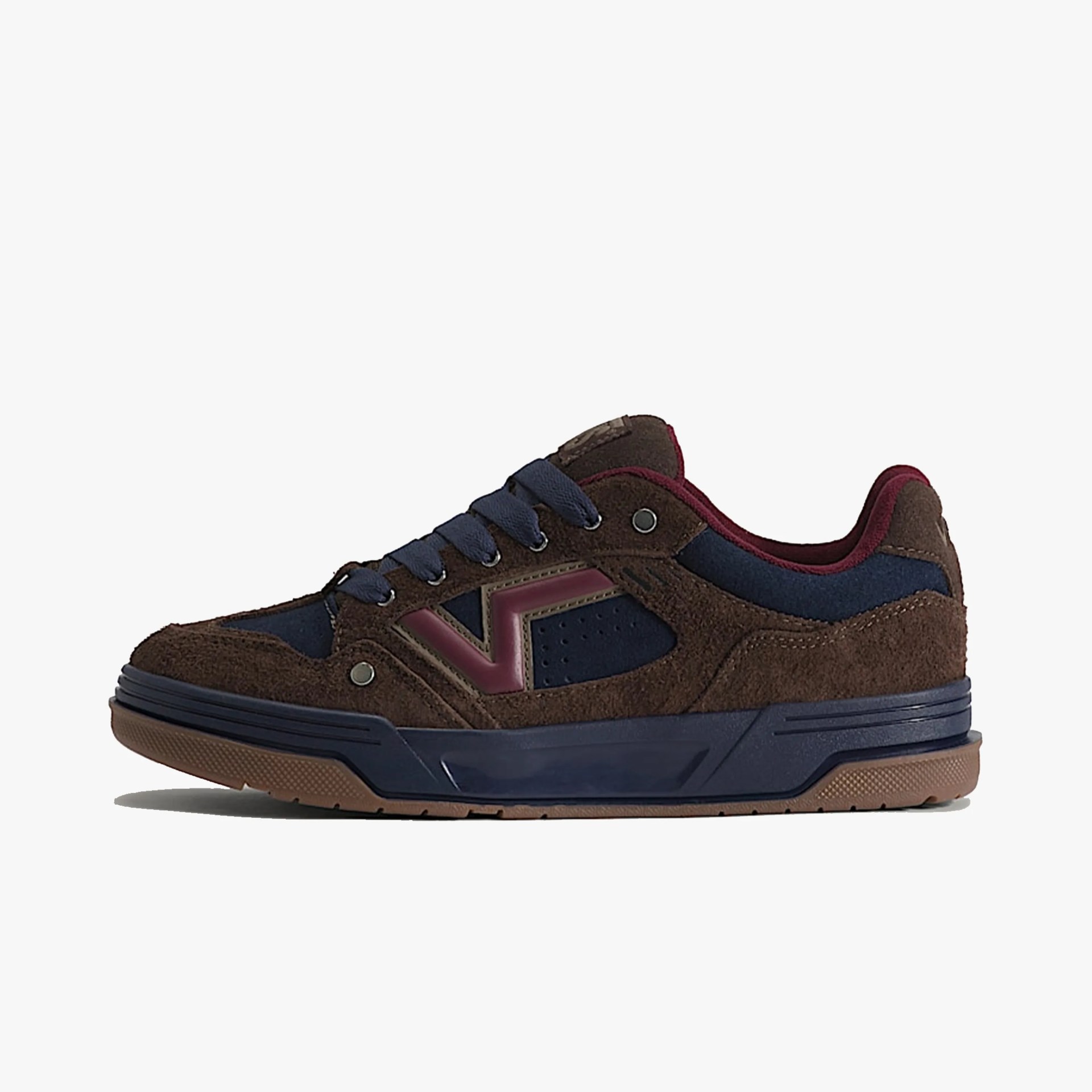 Brown suede and navy blue sneaker with burgundy accents and a gum sole, side view.