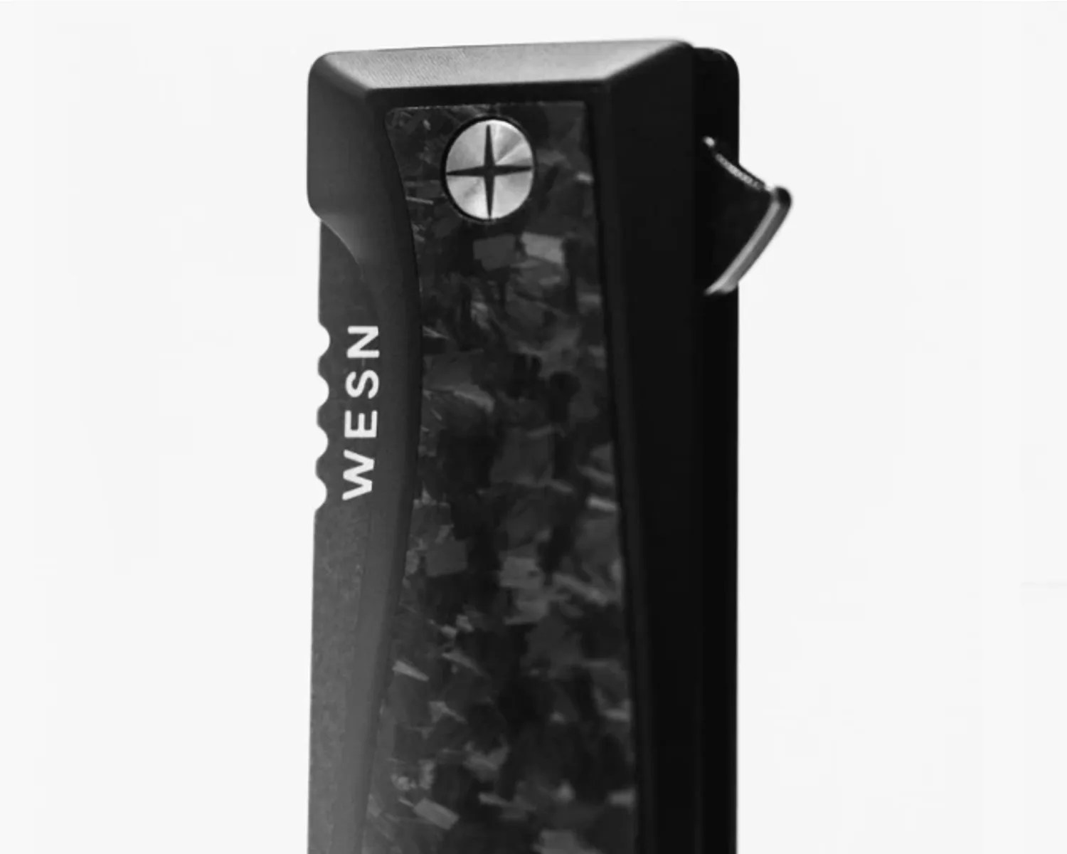 Black and dark gray textured carbon fiber lighter with "WESN" branding and a metal ignition lever.