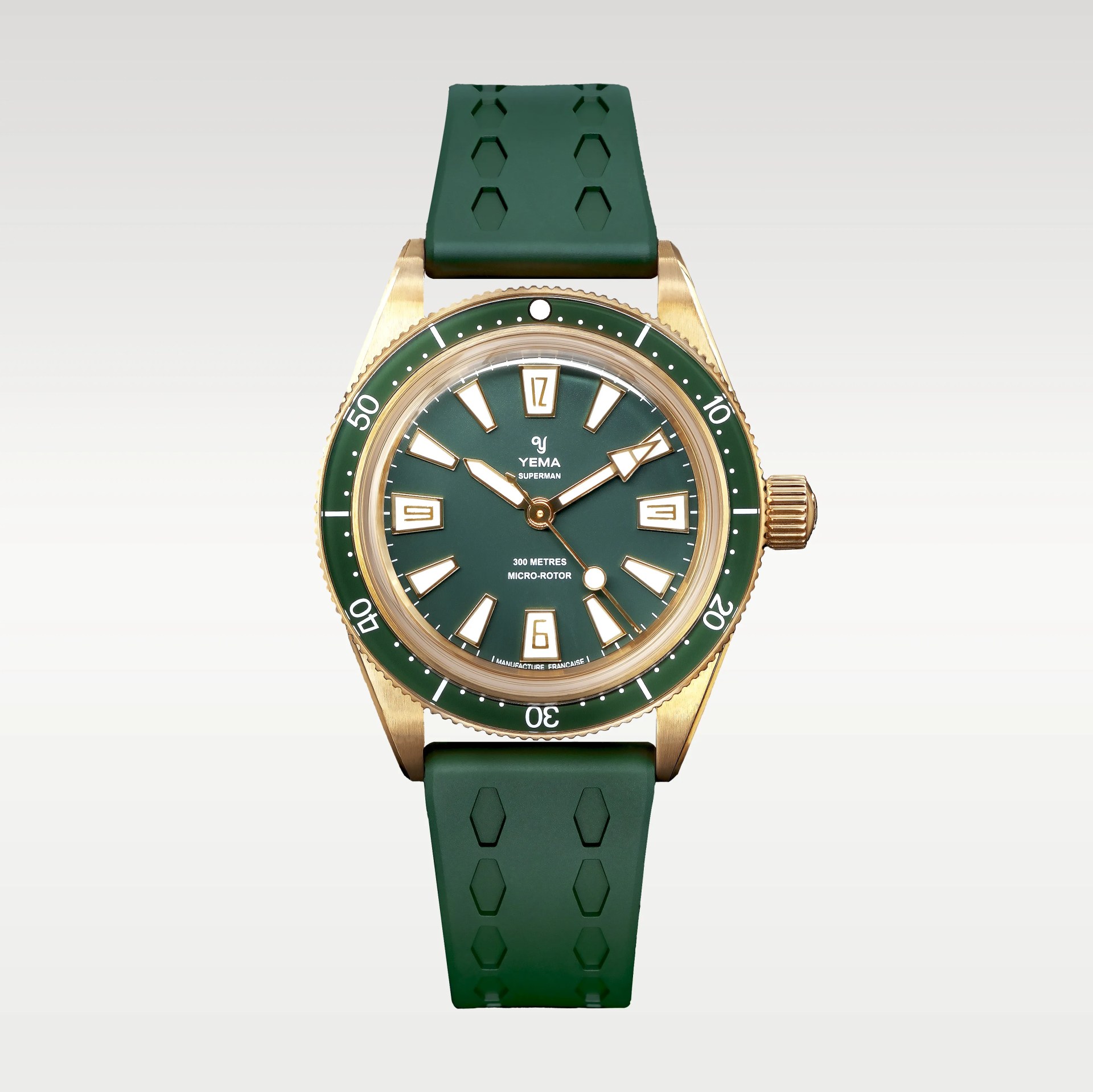 Green dial Yema Superman watch with gold case and green rubber strap.