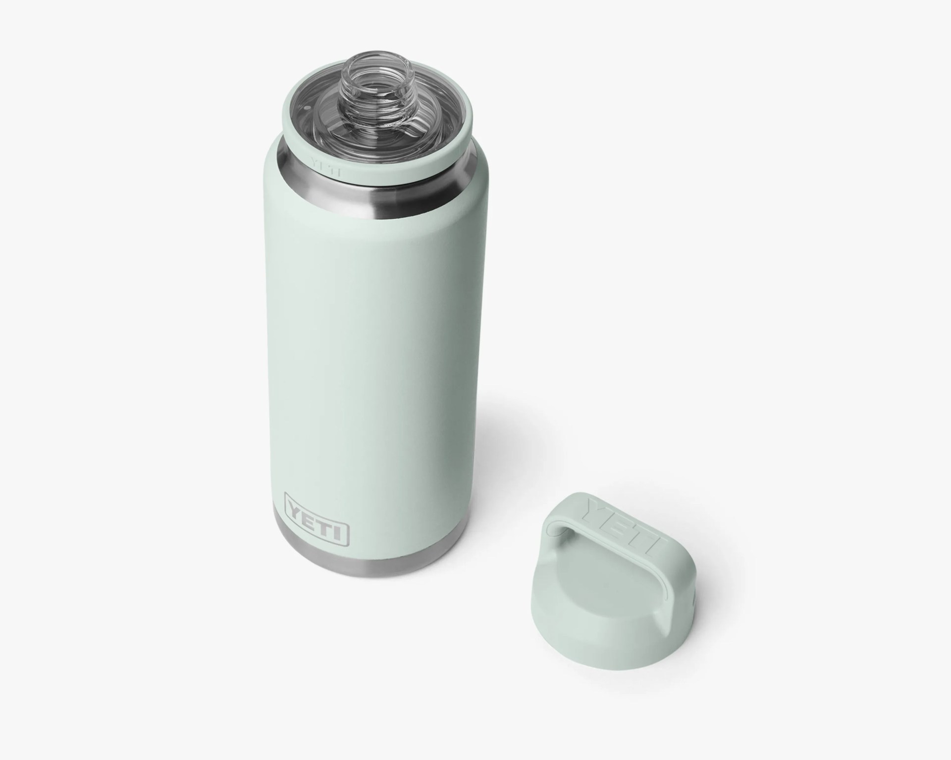 Light green YETI insulated bottle with a clear spout lid and a separate matching screw-on cap on a white background.