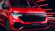 Front view of a red Volkswagen Transporter van with illuminated LED headlights and black grille.