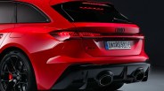Rear view of a red Audi RS5 Sportback with black diffuser, dual exhaust, and tinted rear windows.