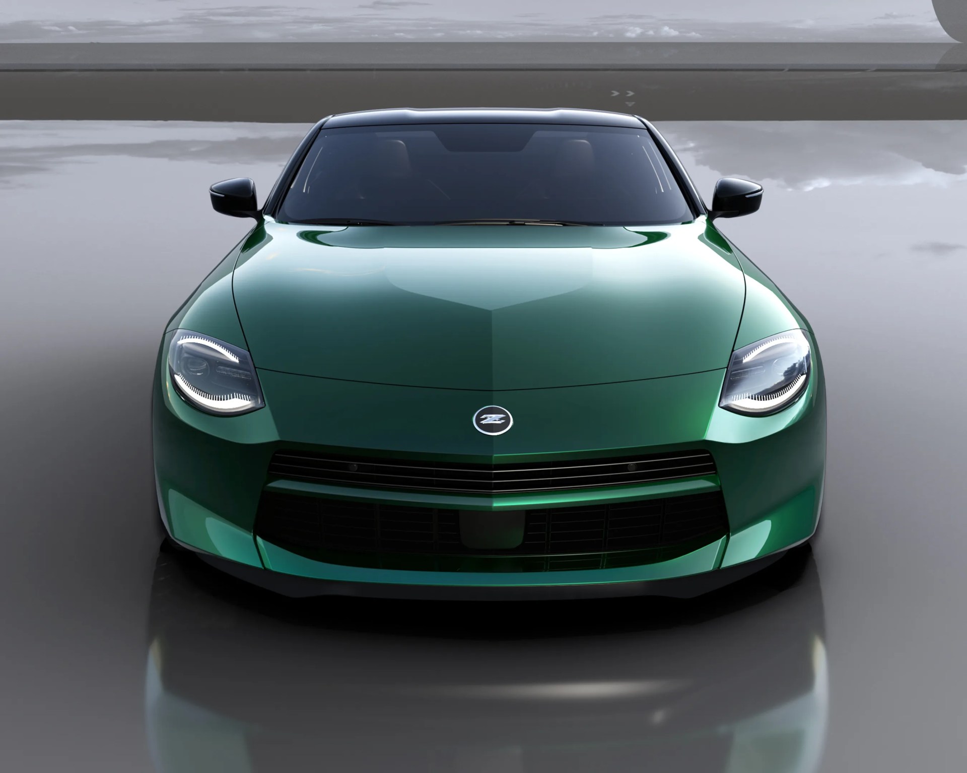 Front view of a metallic green Nissan Z sports car with LED headlights and a black grille on a reflective surface.