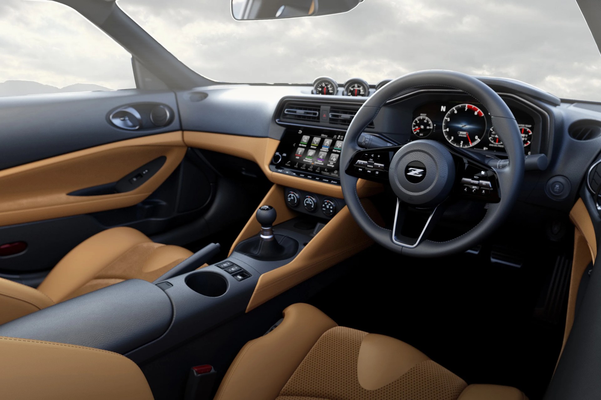 Black and tan leather car interior with manual gear shift, digital dashboard, and multifunction steering wheel with "Z" logo.
