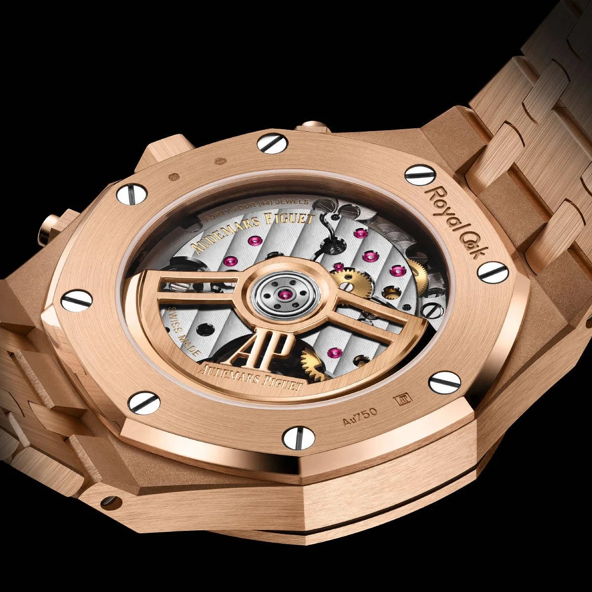 Rose gold Audemars Piguet Royal Oak watch back showing intricate mechanical movement and engraved logo.