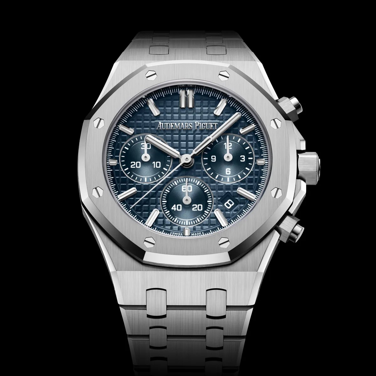 Silver Audemars Piguet Royal Oak chronograph watch with blue textured dial and stainless steel bracelet.