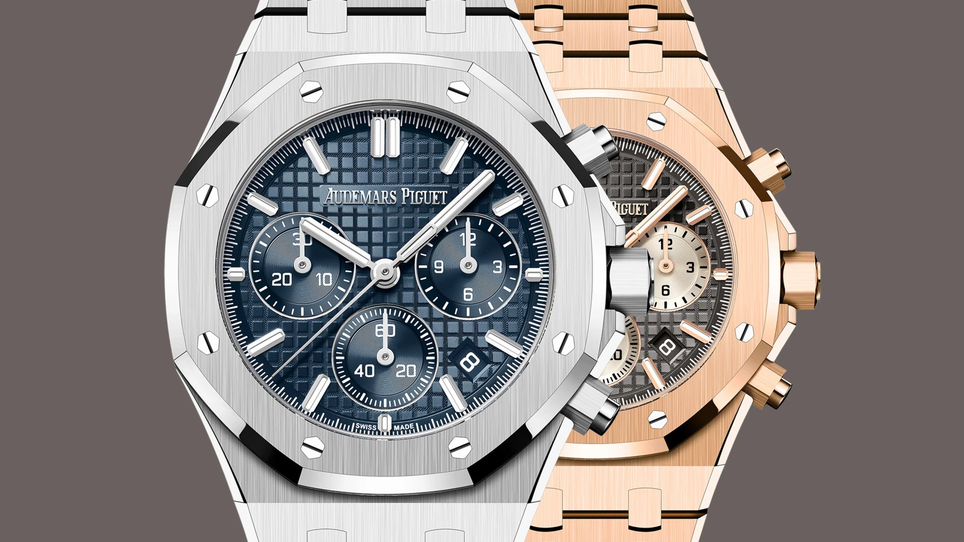 Two luxury Audemars Piguet Royal Oak chronograph watches, one in silver with a blue dial and one in rose gold with a gray dial.