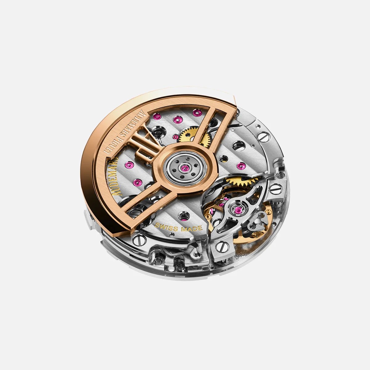 Close-up of a round Audemars Piguet watch movement with gold rotor and visible gears on a white background.