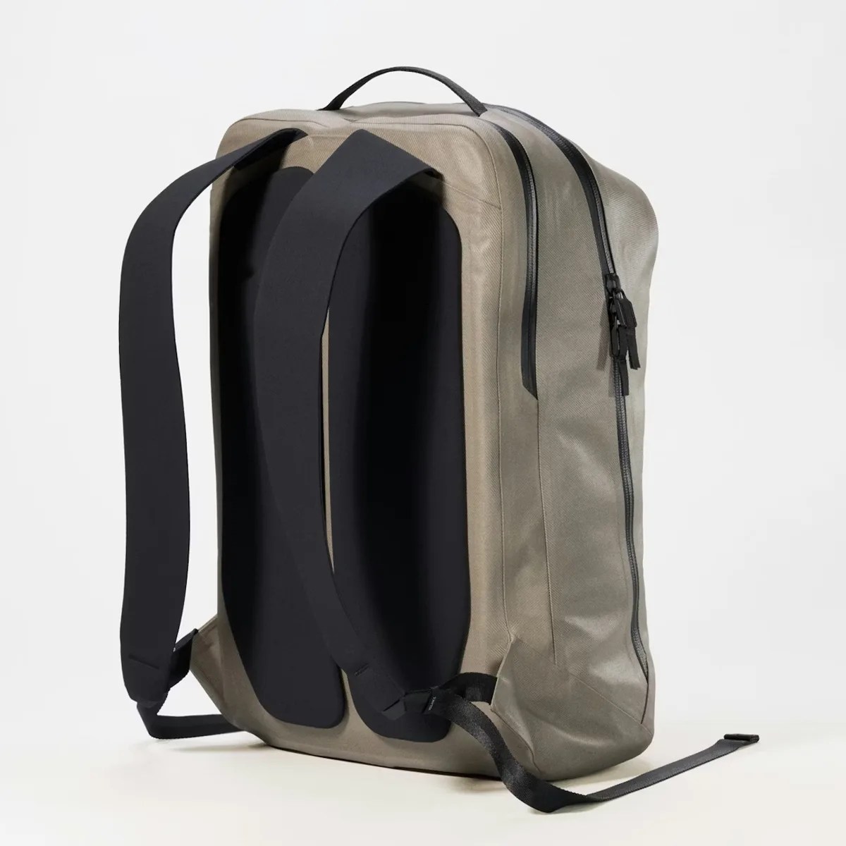 Rectangular olive-green backpack with black padded straps and dual zipper closure on a white background.