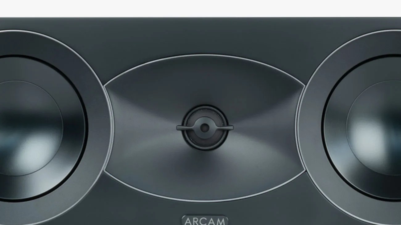 Close-up of a black ARCAM speaker with two large drivers and a central tweeter.