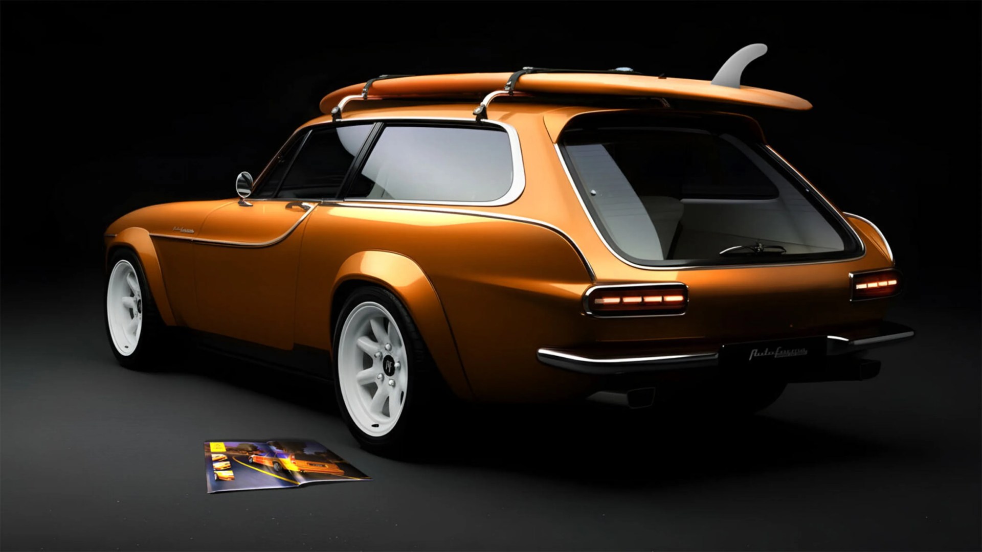Orange vintage-style station wagon with white wheels and a surfboard mounted on the roof.
