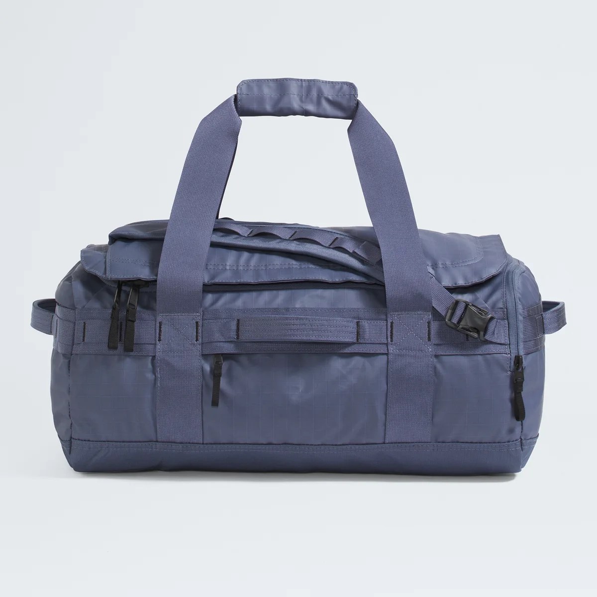 Blue nylon duffel bag with black zippers and wide carrying straps on a white background.