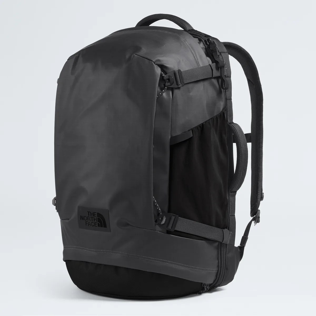 Black and dark gray The North Face backpack with padded shoulder straps and side handles.