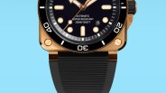 Close-up of a square bronze dive watch with a black dial, black bezel, and black ribbed rubber strap.