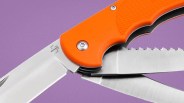 Folding multi-tool knife with orange handle and three stainless steel blades, one serrated.