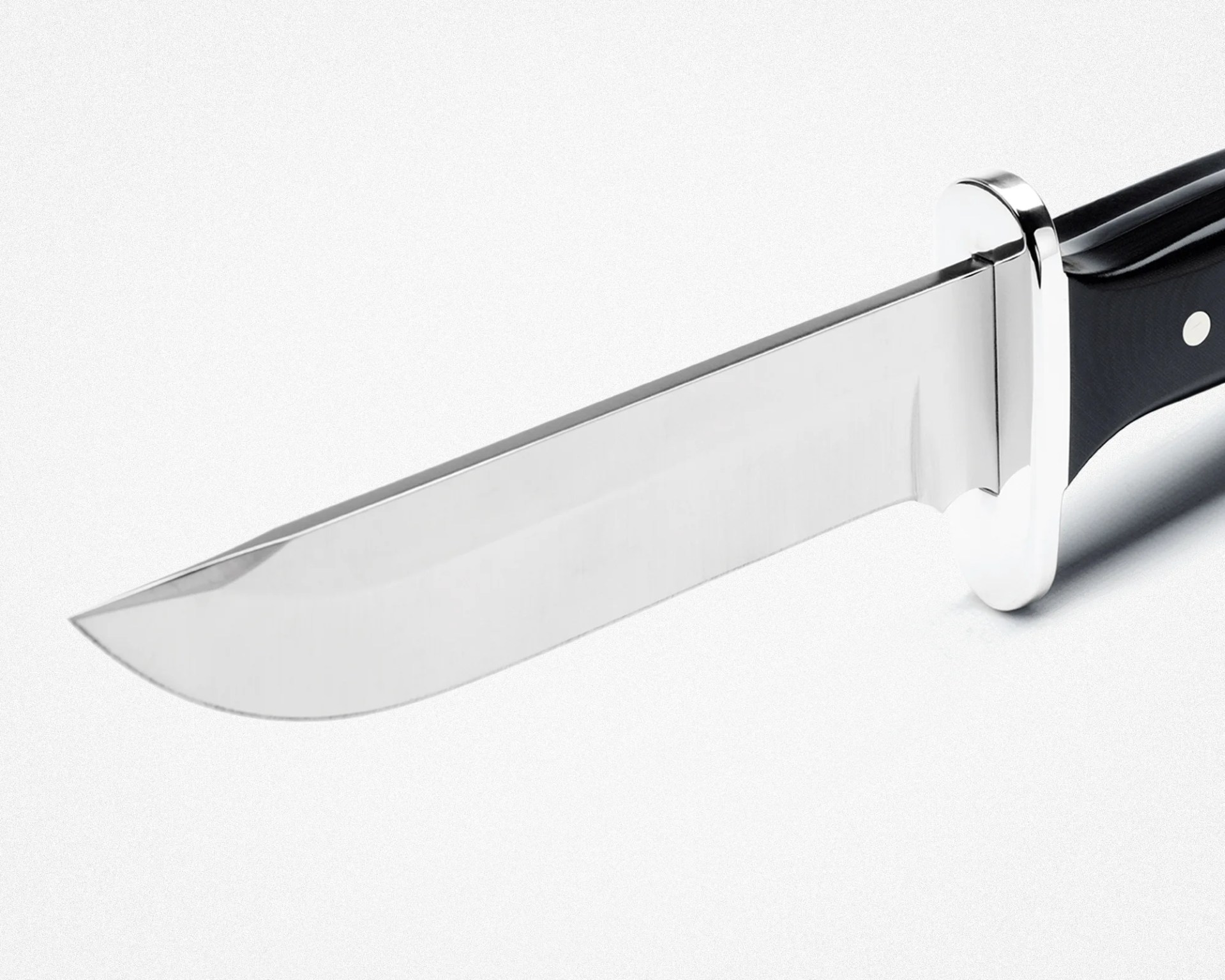 Hunting knife with a polished stainless steel blade and black handle with metal guard.